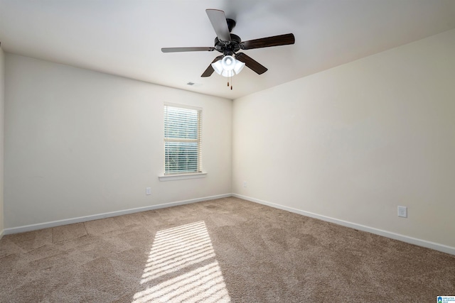 empty room with light carpet and ceiling fan