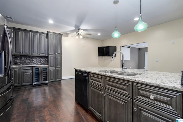 kitchen featuring stainless steel fridge, dark hardwood / wood-style flooring, beverage cooler, sink, and black dishwasher