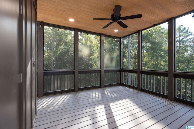 unfurnished sunroom featuring ceiling fan and wooden ceiling