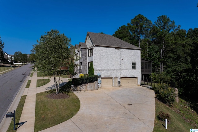 view of side of home with a garage