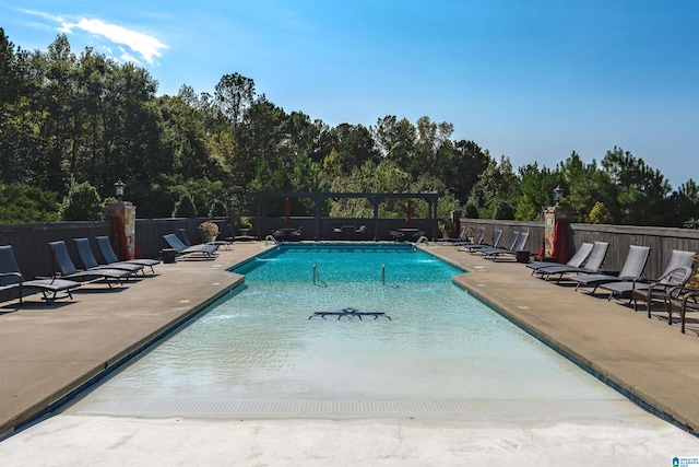 view of swimming pool featuring a patio area