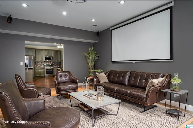 home theater featuring hardwood / wood-style floors