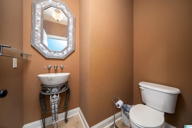 bathroom featuring sink and toilet