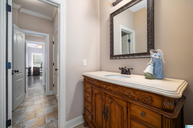 bathroom with vanity and crown molding