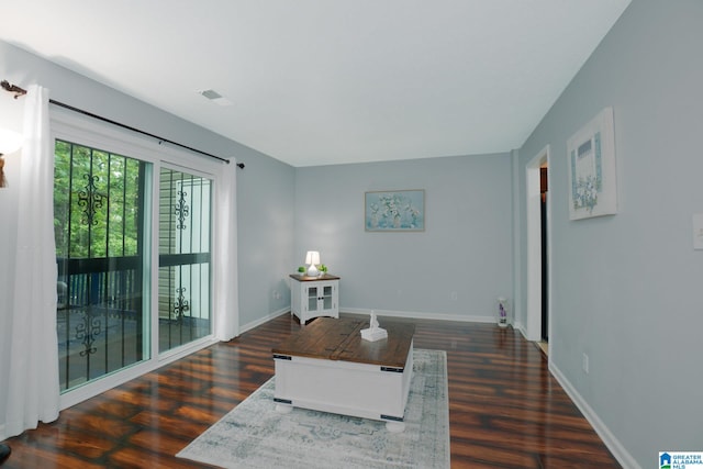 sitting room with dark hardwood / wood-style floors