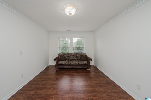 sitting room featuring dark hardwood / wood-style flooring and ornamental molding