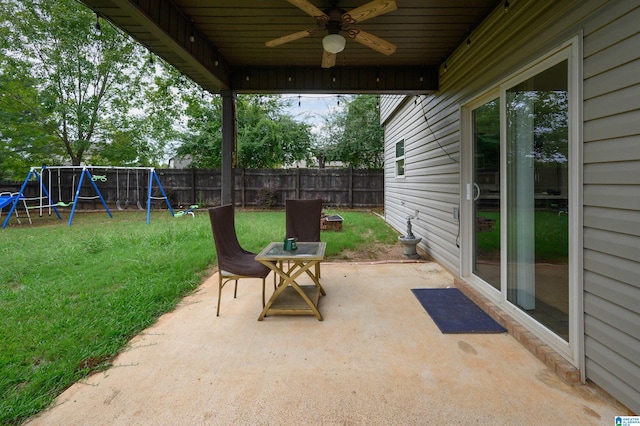 view of patio / terrace featuring ceiling fan and a playground