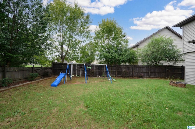 exterior space featuring a fire pit and a lawn