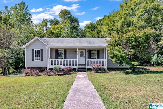 single story home with covered porch and a front lawn