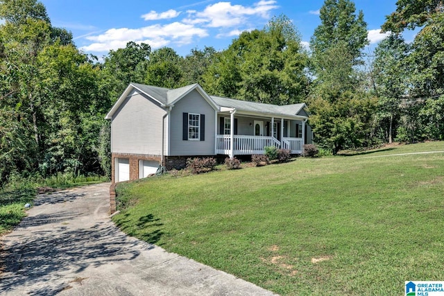 single story home featuring a front yard, a porch, and a garage