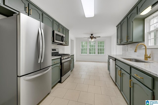 full bathroom with tile patterned flooring, vanity, toilet, and tiled shower / bath combo