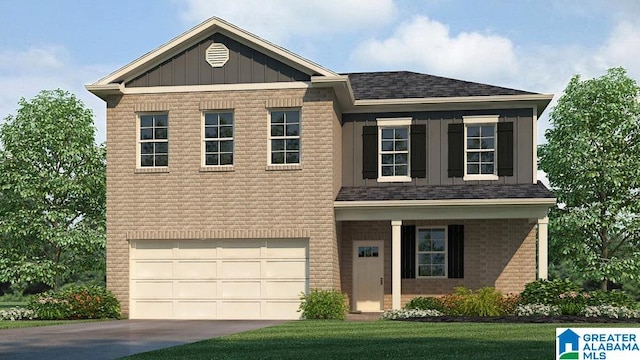 view of front of house with a garage and a front lawn