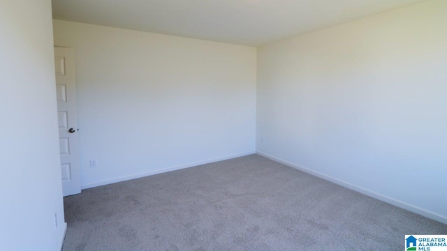 unfurnished room with carpet flooring