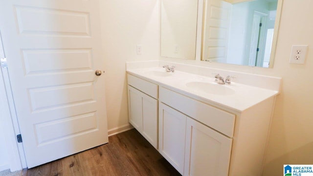 bathroom with vanity and hardwood / wood-style flooring