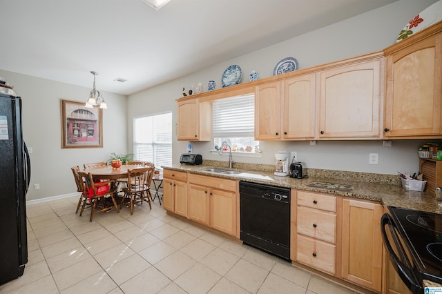 kitchen with light brown cabinetry, sink, light tile patterned flooring, and black appliances