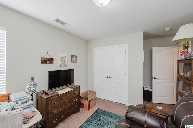 living room featuring light carpet