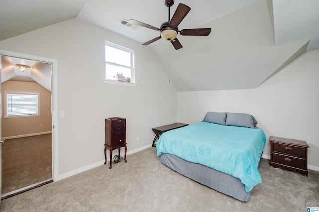 carpeted bedroom featuring ceiling fan, lofted ceiling, and multiple windows