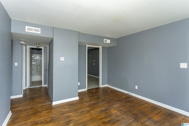 7749 5th Ave, Birmingham, AL 35206 - spare room featuring wood finished floors and baseboards