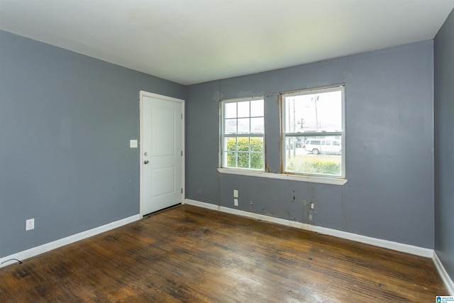 7749 5th Ave, Birmingham, AL 35206 - unfurnished room featuring wood finished floors and baseboards