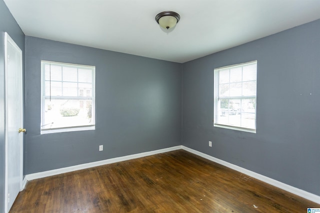 7749 5th Ave, Birmingham, AL 35206 - spare room with wood finished floors and baseboards