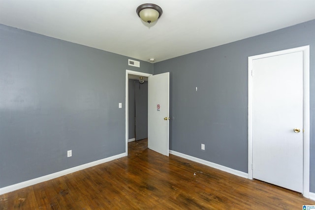 7749 5th Ave, Birmingham, AL 35206 - spare room with wood finished floors and baseboards