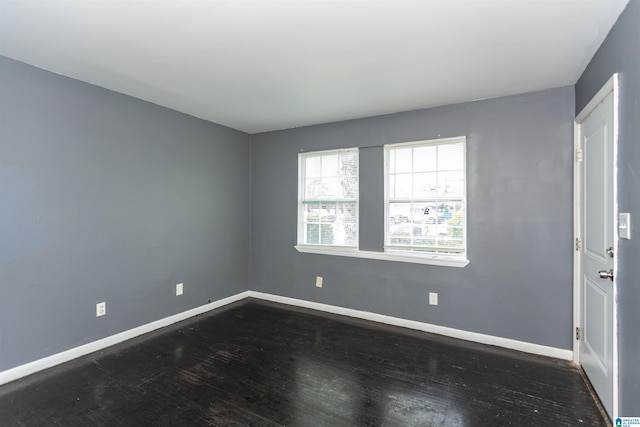 7749 5th Ave, Birmingham, AL 35206 - unfurnished room with dark wood-style floors and baseboards