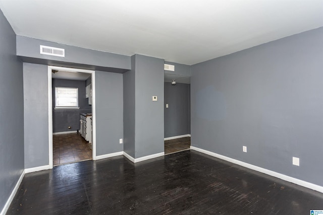 7749 5th Ave, Birmingham, AL 35206 - empty room featuring wood finished floors and baseboards