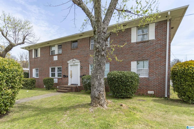 7749 5th Ave, Birmingham, AL 35206 - view of front facade with brick siding and a front lawn