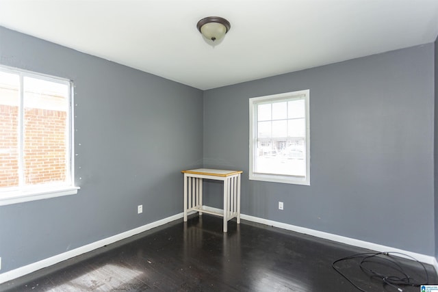 7749 5th Ave, Birmingham, AL 35206 - unfurnished room with baseboards and wood finished floors