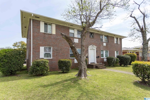 7749 5th Ave, Birmingham, AL 35206 - townhome / multi-family property with a front lawn and brick siding
