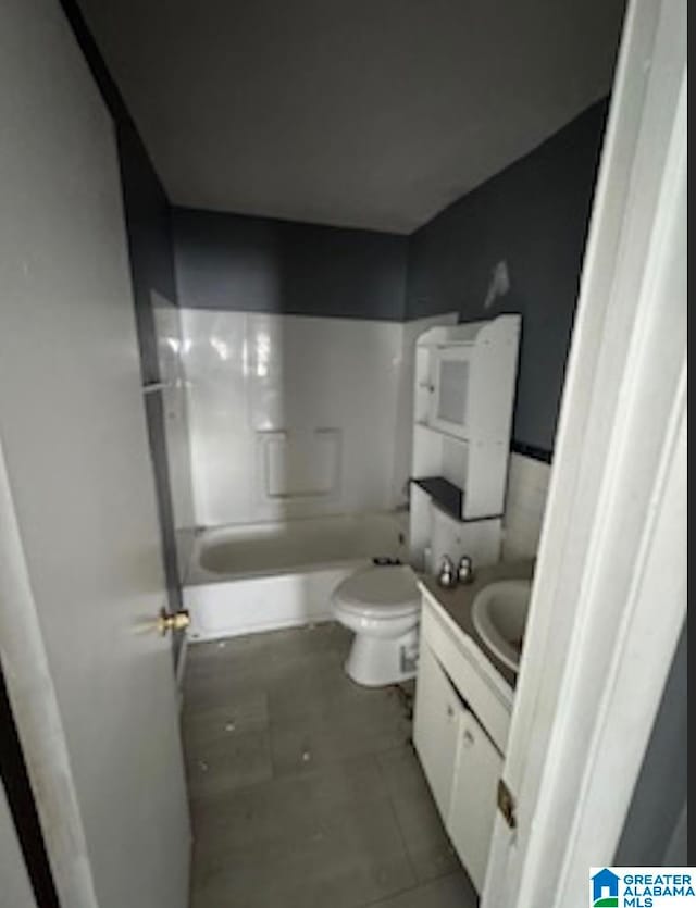 full bathroom featuring bathtub / shower combination, tile patterned floors, vanity, and toilet