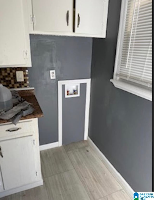 kitchen featuring white cabinetry