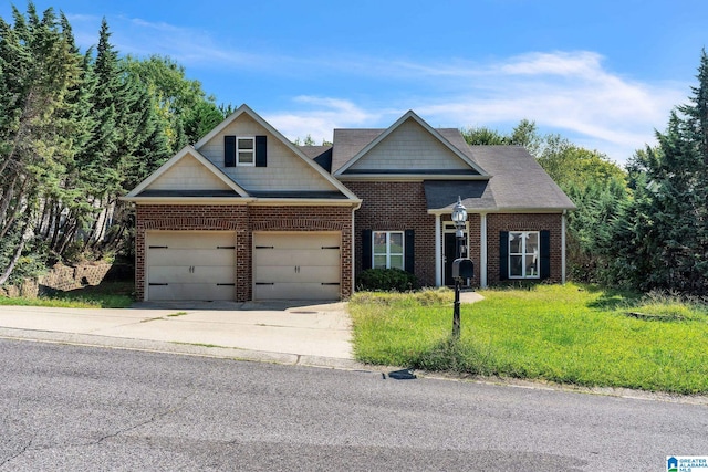 craftsman house with a garage and a front lawn