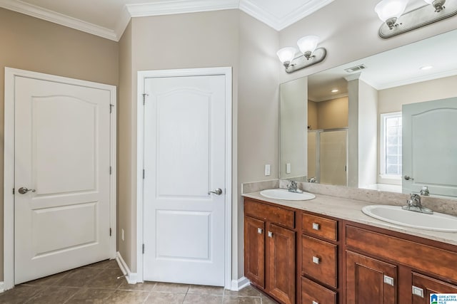 bathroom featuring crown molding, tile patterned flooring, a shower with door, and vanity