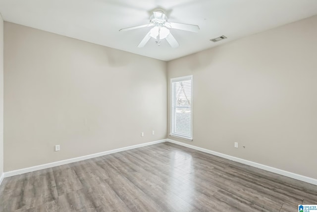 unfurnished room featuring ceiling fan and hardwood / wood-style floors