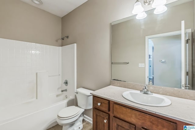 full bathroom featuring an inviting chandelier, vanity, bathing tub / shower combination, toilet, and tile patterned flooring