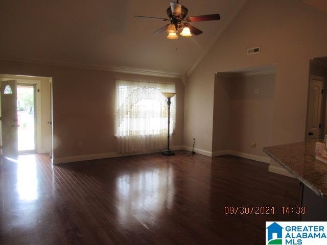 unfurnished living room featuring high vaulted ceiling, ceiling fan, dark wood-type flooring, and crown molding