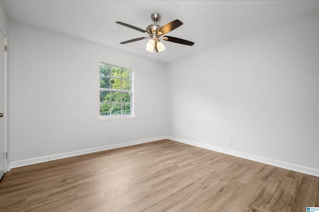 unfurnished room featuring ornamental molding, ceiling fan, and light hardwood / wood-style flooring