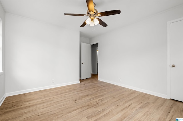 empty room featuring ceiling fan and light hardwood / wood-style flooring