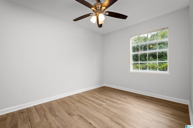 unfurnished room featuring ceiling fan, crown molding, and light hardwood / wood-style floors