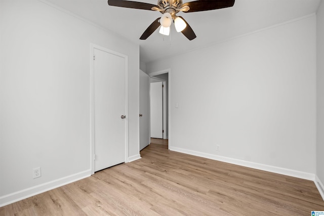 unfurnished bedroom with light hardwood / wood-style floors and ceiling fan