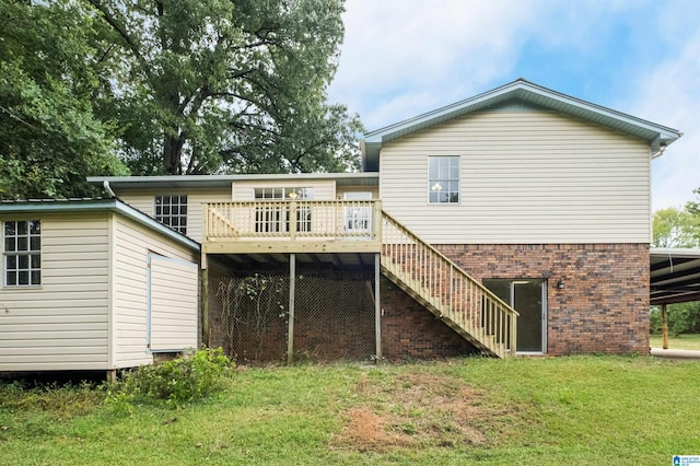 back of house featuring a wooden deck and a yard