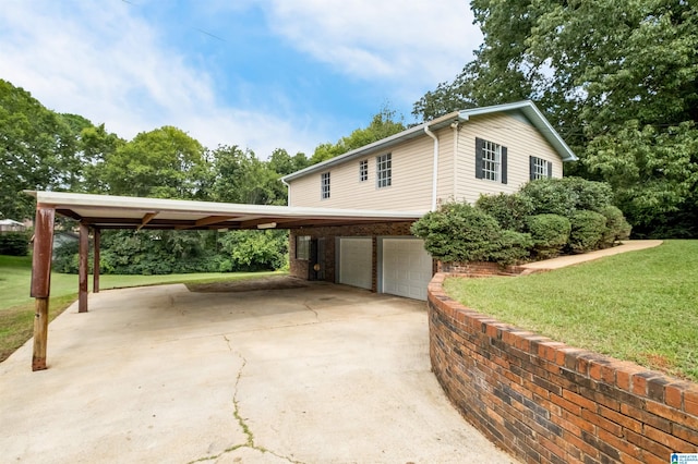 view of side of home with a lawn and a garage