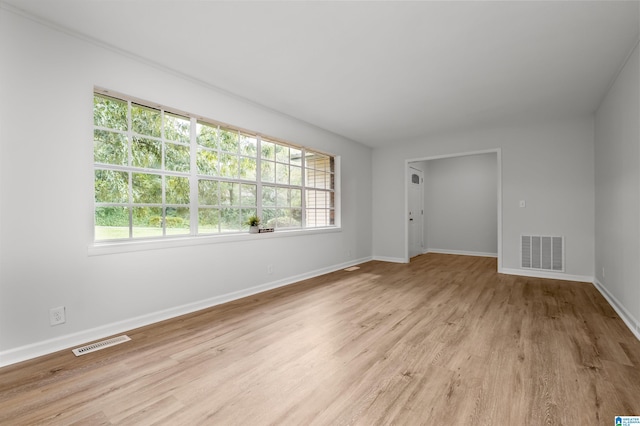 spare room with light hardwood / wood-style flooring