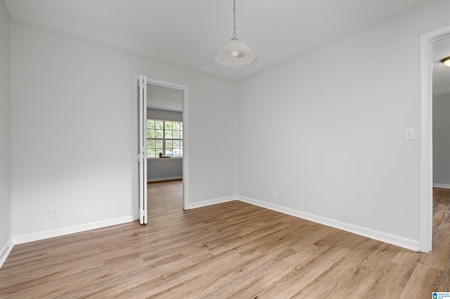 unfurnished room with light hardwood / wood-style floors