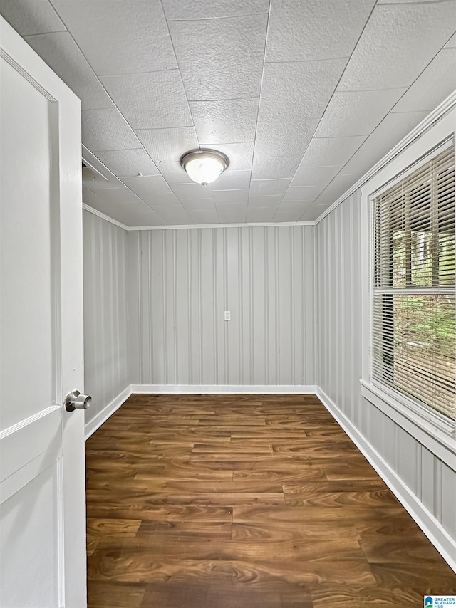 unfurnished room with hardwood / wood-style floors