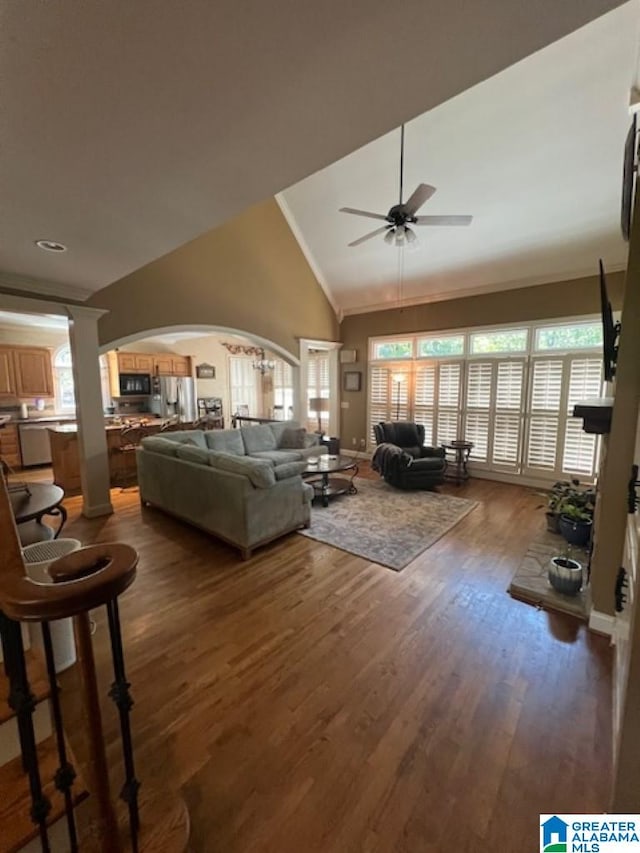 living room with high vaulted ceiling, ceiling fan, and dark hardwood / wood-style floors