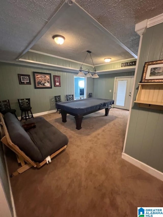 rec room featuring pool table, ornamental molding, carpet, and a textured ceiling