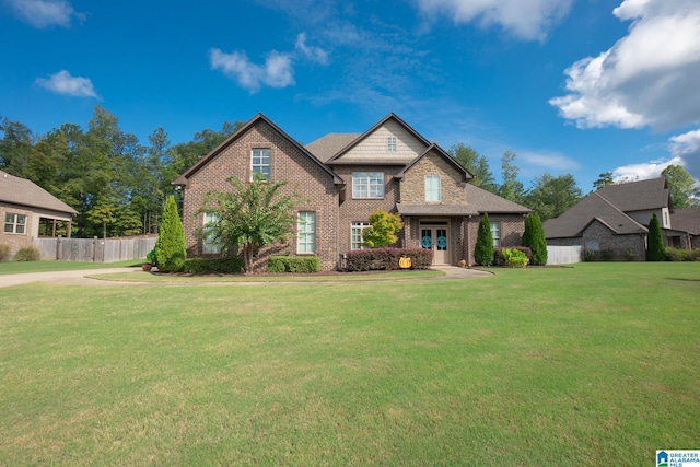 craftsman-style house featuring a front lawn