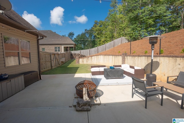 view of patio / terrace featuring an outdoor living space with a fire pit